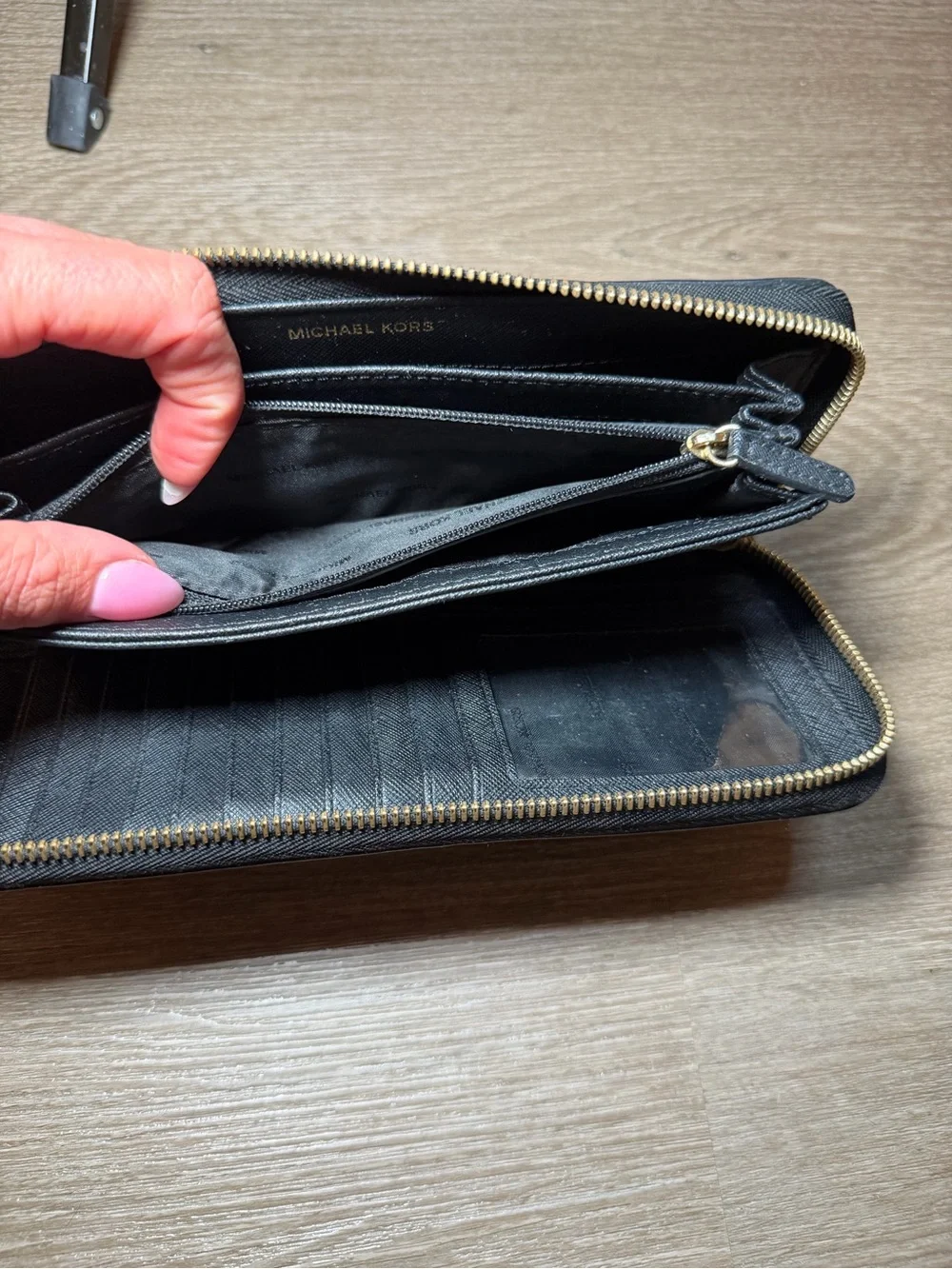Michael Kors Black Zip-Around Saffiano Wallet with Gold Logo